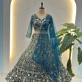 Luxury Teal Blue Butterfly Net Heavy Embroidered Bridal Lehenga Choli with Dupatta