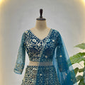 Luxury Teal Blue Butterfly Net Heavy Embroidered Bridal Lehenga Choli with Dupatta