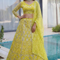 Beautiful Yellow Butterfly Net Heavy Embroidered Bridal Lehenga Choli with Dupatta