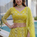 Beautiful Yellow Butterfly Net Heavy Embroidered Bridal Lehenga Choli with Dupatta