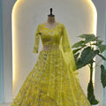 Beautiful Yellow Butterfly Net Heavy Embroidered Bridal Lehenga Choli with Dupatta