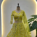 Beautiful Yellow Butterfly Net Heavy Embroidered Bridal Lehenga Choli with Dupatta