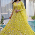 Beautiful Yellow Butterfly Net Heavy Embroidered Bridal Lehenga Choli with Dupatta