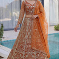 Awesome Rust Orange Butterfly Net Heavy Embroidered Bridal Lehenga Choli with Dupatta