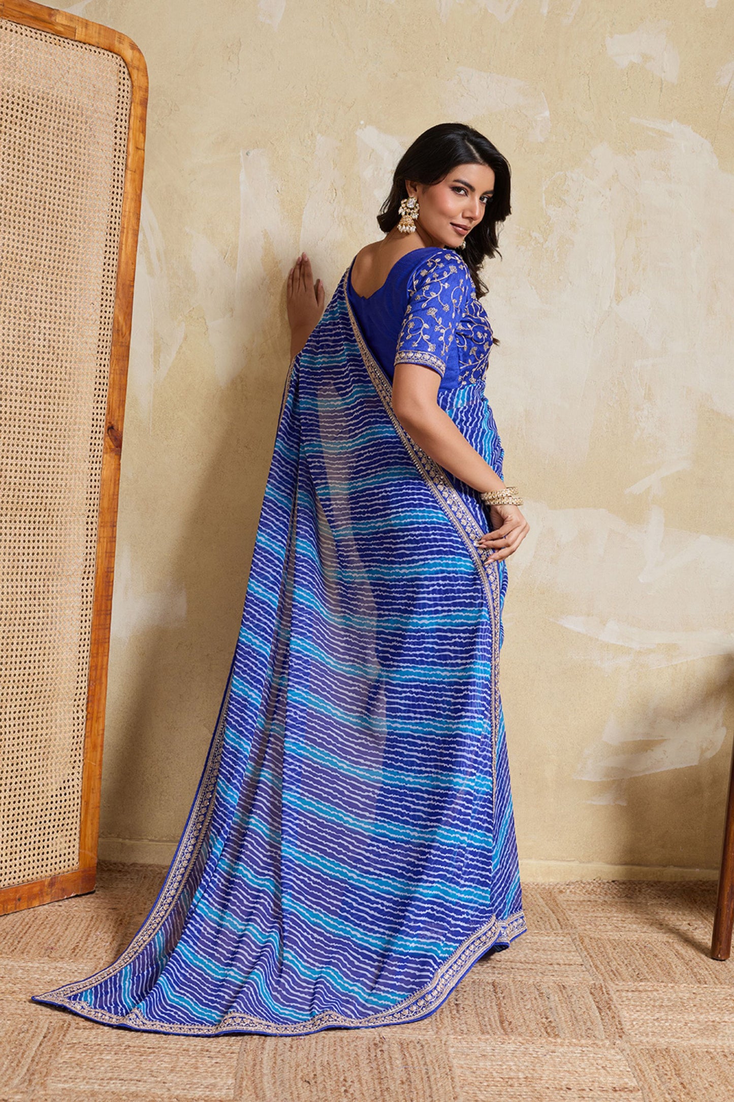 Blue Georgette Saree with Golden Embroidered Border Designer Blouse