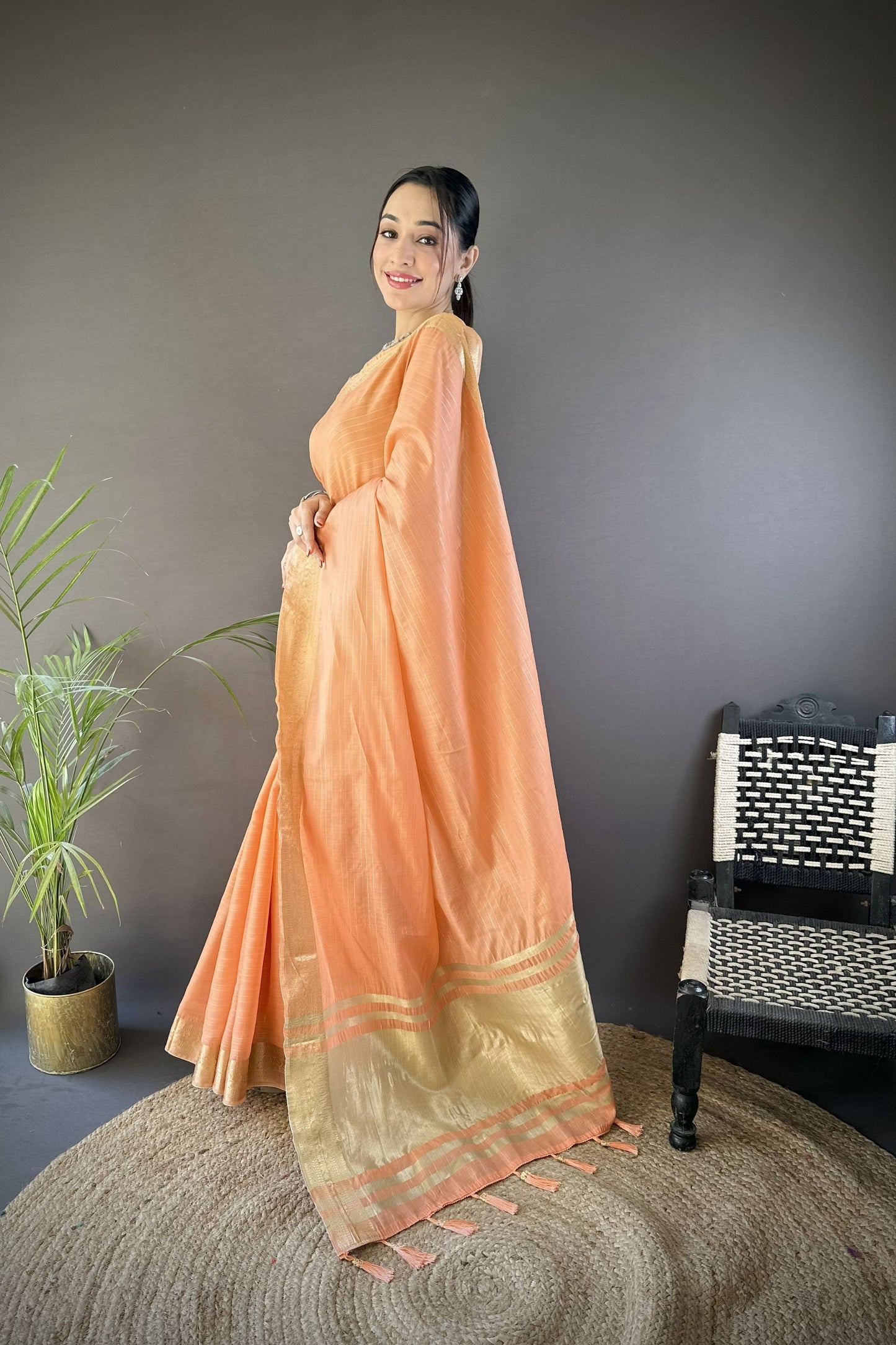 Peach Linen Silk Saree with Rich Golden Zari Border Tassel Pallu