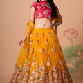 Imperial Mustard Yellow Soft Net Embroidered Lehenga Choli with Red Blouse and Dupatta