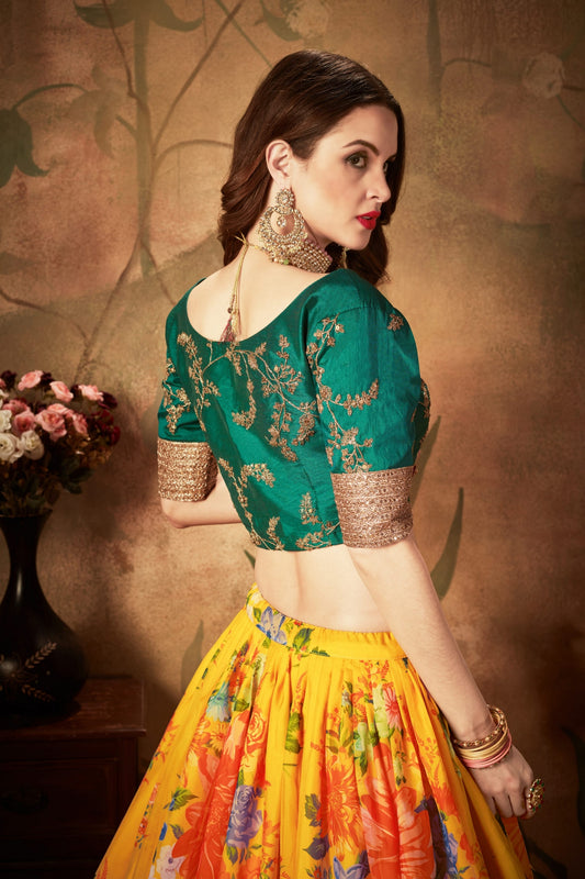 Luxurious Green Embroidered Silk Blouse with Yellow Floral Printed Organza Lehenga Choli
