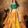 Luxurious Green Embroidered Silk Blouse with Yellow Floral Printed Organza Lehenga Choli