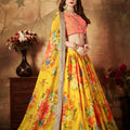 Vibrant Peach Embroidered Silk Blouse with Yellow Floral Printed Organza Lehenga Choli