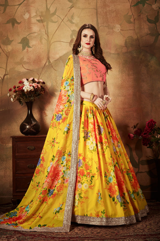 Vibrant Peach Embroidered Silk Blouse with Yellow Floral Printed Organza Lehenga Choli