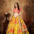 Vibrant Peach Embroidered Silk Blouse with Yellow Floral Printed Organza Lehenga Choli