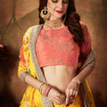 Vibrant Peach Embroidered Silk Blouse with Yellow Floral Printed Organza Lehenga Choli