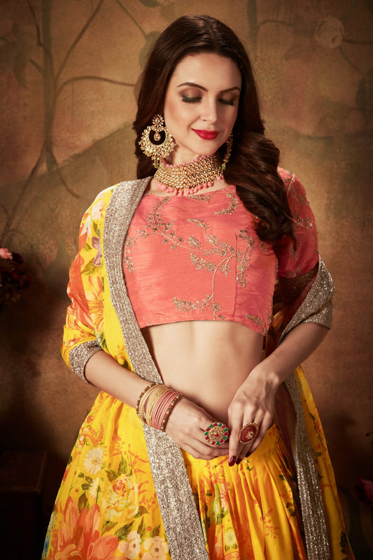 Vibrant Peach Embroidered Silk Blouse with Yellow Floral Printed Organza Lehenga Choli