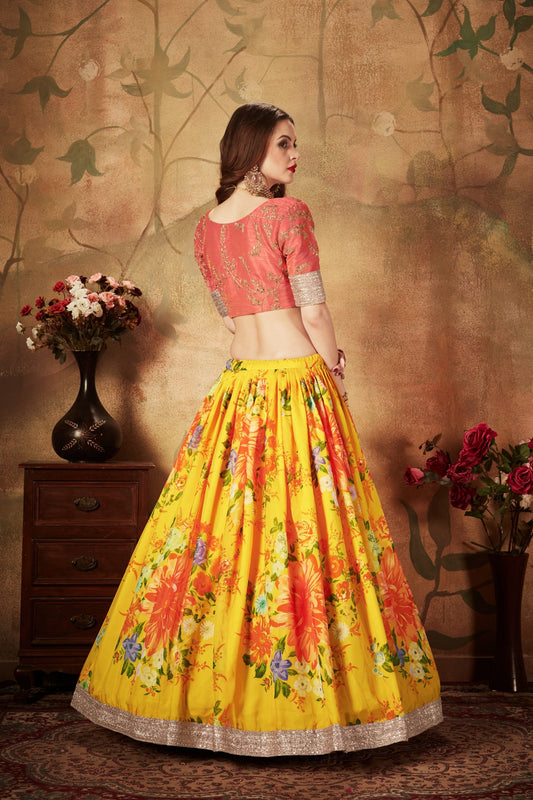 Vibrant Peach Embroidered Silk Blouse with Yellow Floral Printed Organza Lehenga Choli
