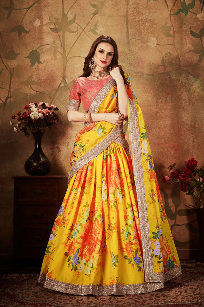 Vibrant Peach Embroidered Silk Blouse with Yellow Floral Printed Organza Lehenga Choli 