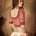Delicate Peach Embroidered Silk Blouse with Cream Floral Printed Organza Lehenga Choli
