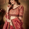 Stylish Peach Embroidered Silk Blouse with Red Floral Printed Organza Lehenga Choli