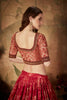 Stylish Peach Embroidered Silk Blouse with Red Floral Printed Organza Lehenga Choli