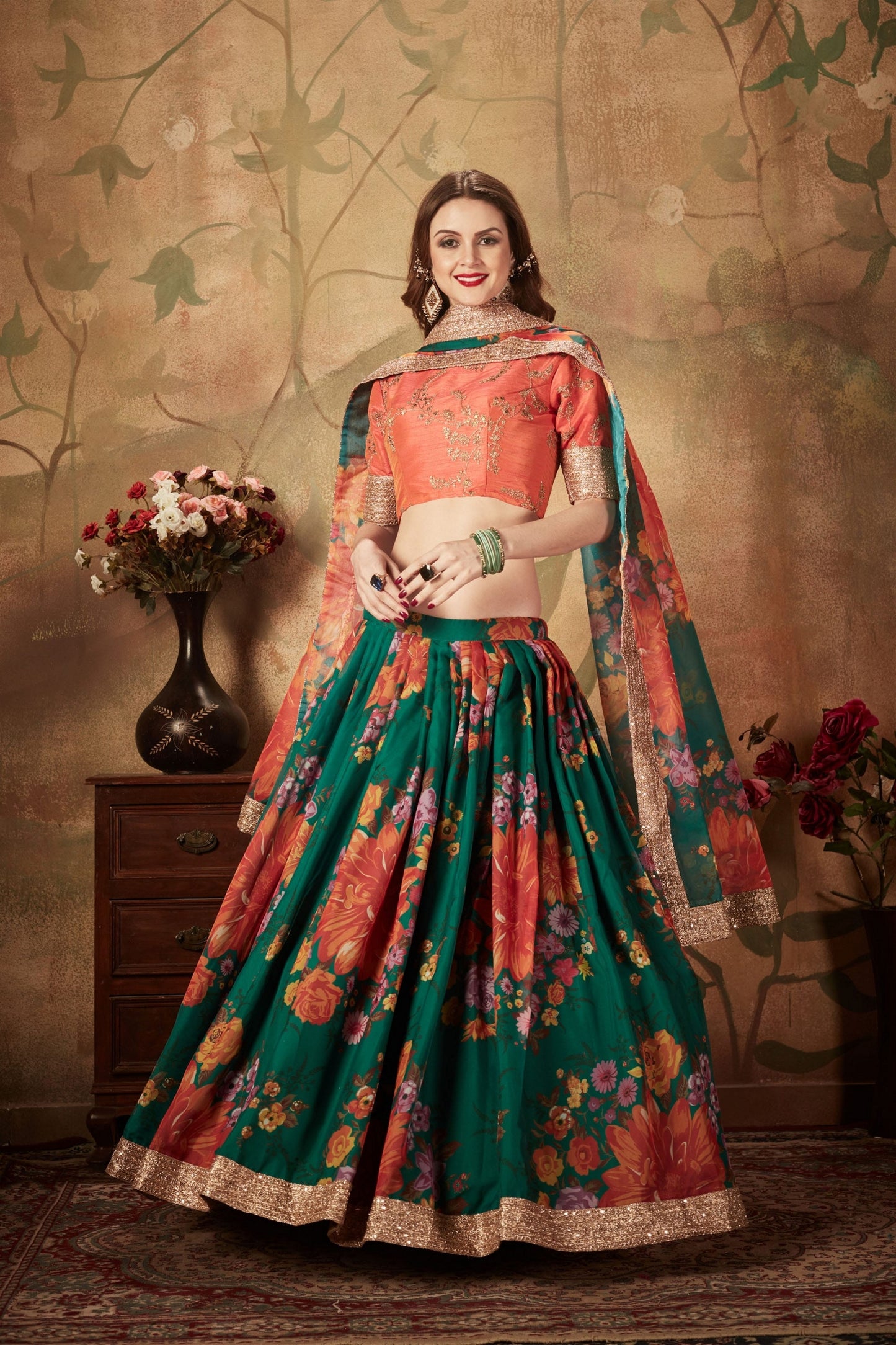 Trendy Orange Embroidered Silk Blouse with Green Floral Printed Organza Lehenga Choli