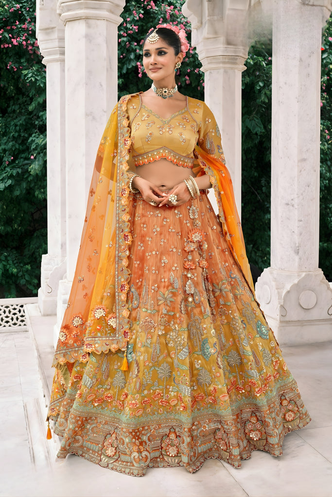 Sterling Mustard Yellow and Orange Embroidered Silk Bridal Lehenga Choli with Floral Work and Net Dupatta