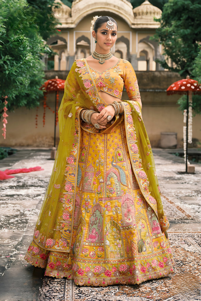 Vibrant Mustard Yellow Embroidered Silk Bridal Lehenga Choli with Traditional Motifs and Net Dupatta