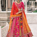 Royal Rani Pink and Orange Embroidered Silk Bridal Lehenga Choli with Heavy Zari Work and Net Dupatta