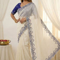 Off White Organza Saree with Blue Embroidered Border