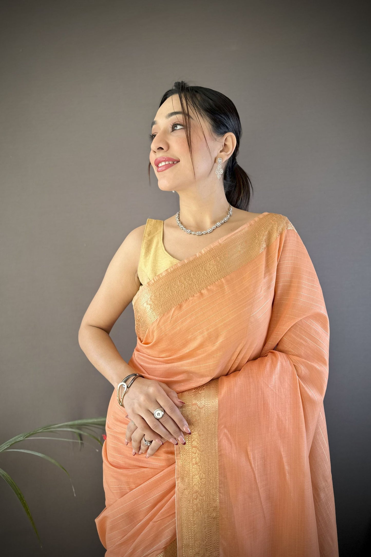 Peach Linen Silk Saree with Rich Golden Zari Border Tassel Pallu