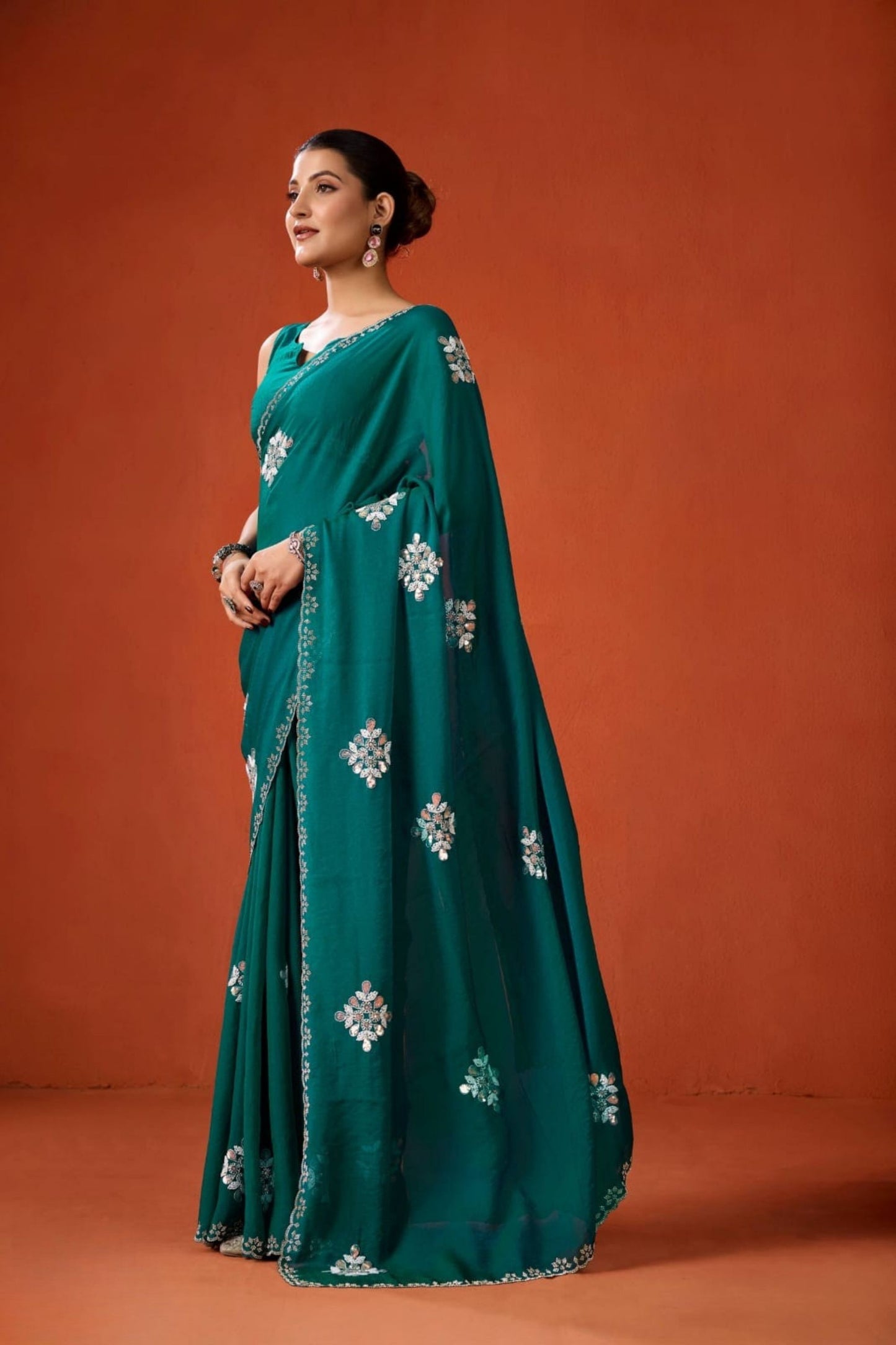 Teal Green Embroidered Georgette Saree Floral Motifs Designer Border