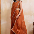 Rust Orange Georgette Saree with Silver Zari Border Butti Work