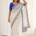 Off White Organza Saree with Blue Embroidered Border