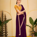 Purple Georgette Saree with Heavy Embroidered Yellow Blouse