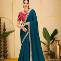 Teal Blue Georgette Saree with Heavy Embroidered Pink Blouse