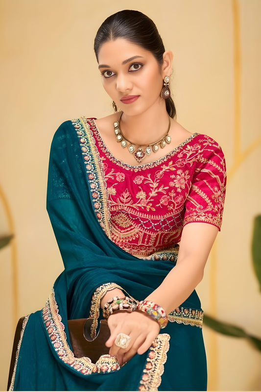 Teal Blue Georgette Saree with Heavy Embroidered Pink Blouse