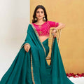 Green Georgette Saree with Pink Embroidered Blouse