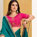 Green Georgette Saree with Pink Embroidered Blouse