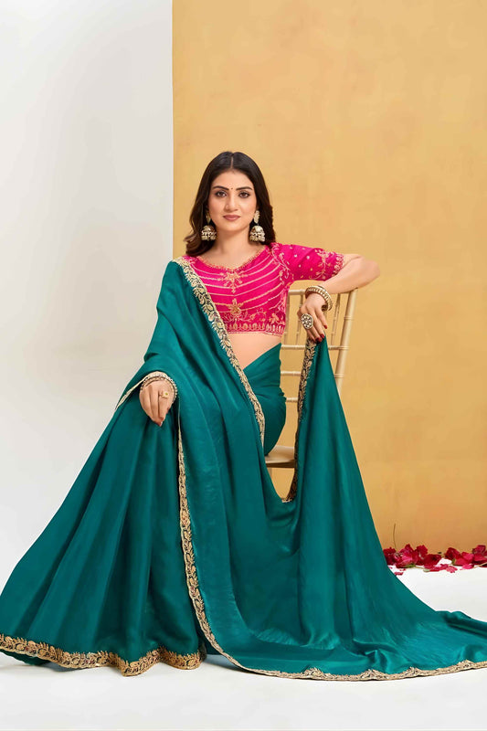 Green Georgette Saree with Pink Embroidered Blouse