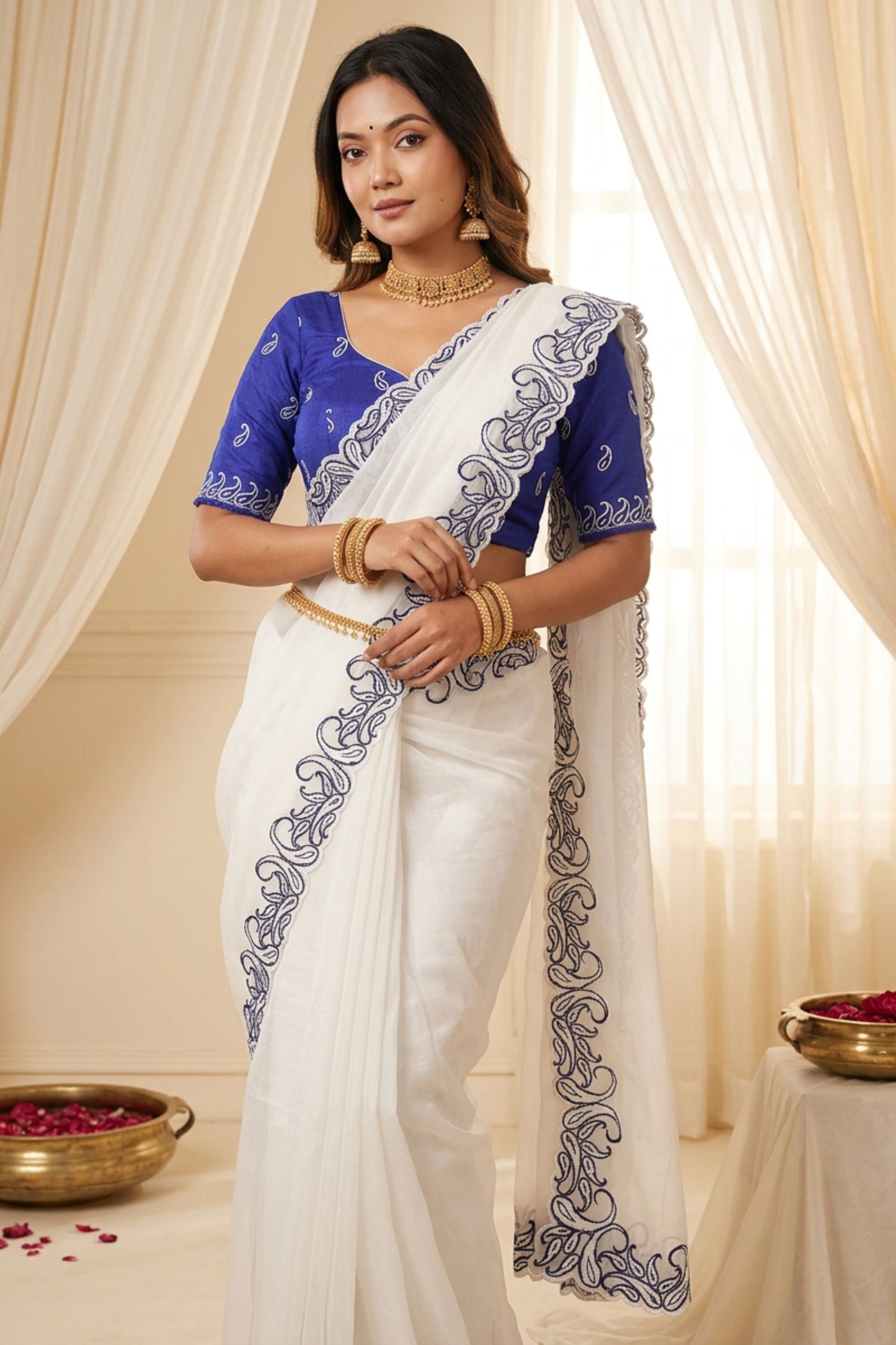 Off White Organza Saree with Blue Embroidered Border