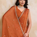 Rust Orange Georgette Saree with Silver Zari Border Butti Work