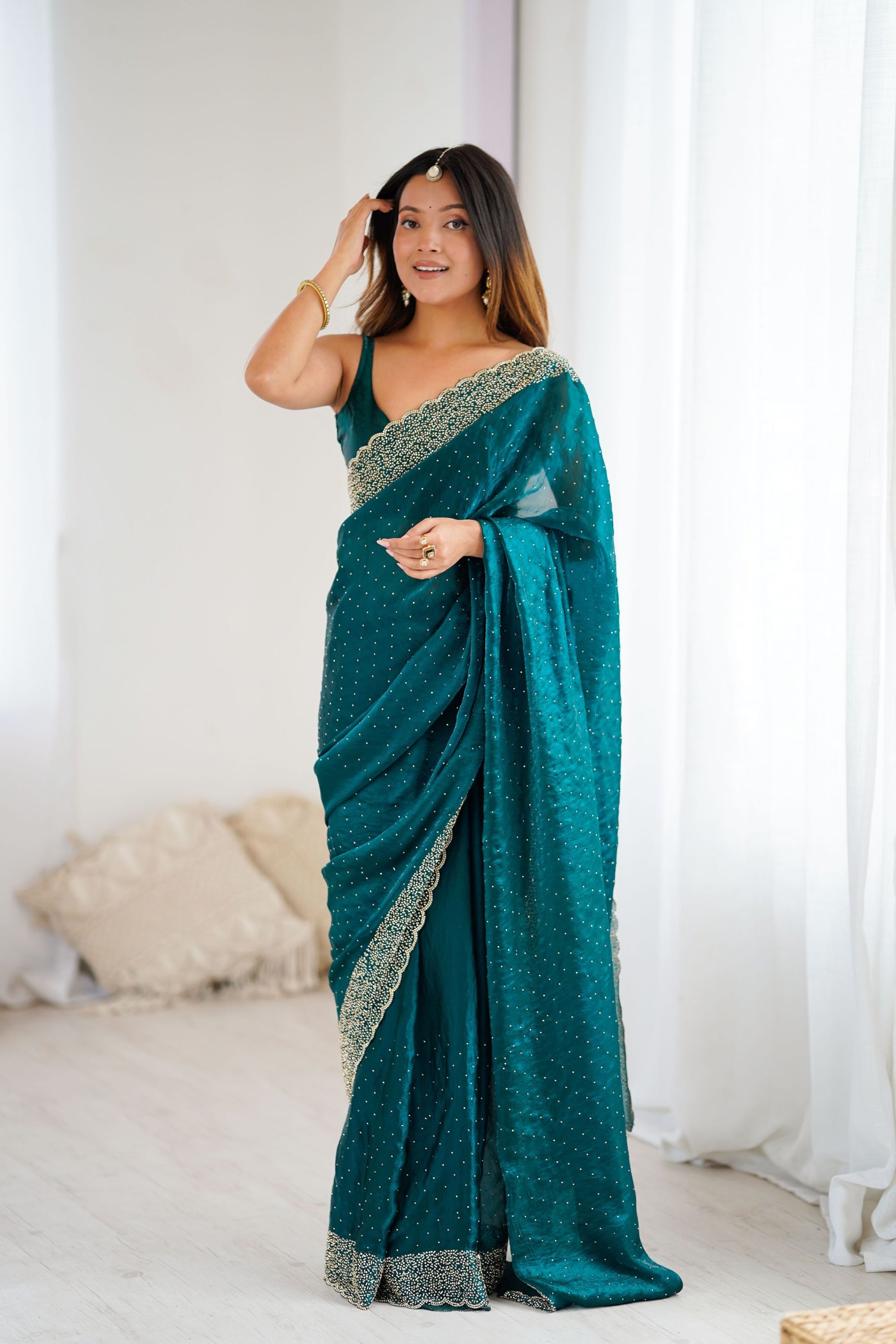 Teal Green Designer Georgette Saree with Heavy Golden Embroidered Border 