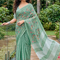 Mint Green Linen Cotton Saree Multicolor Floral Embroidery Tassel Pallu