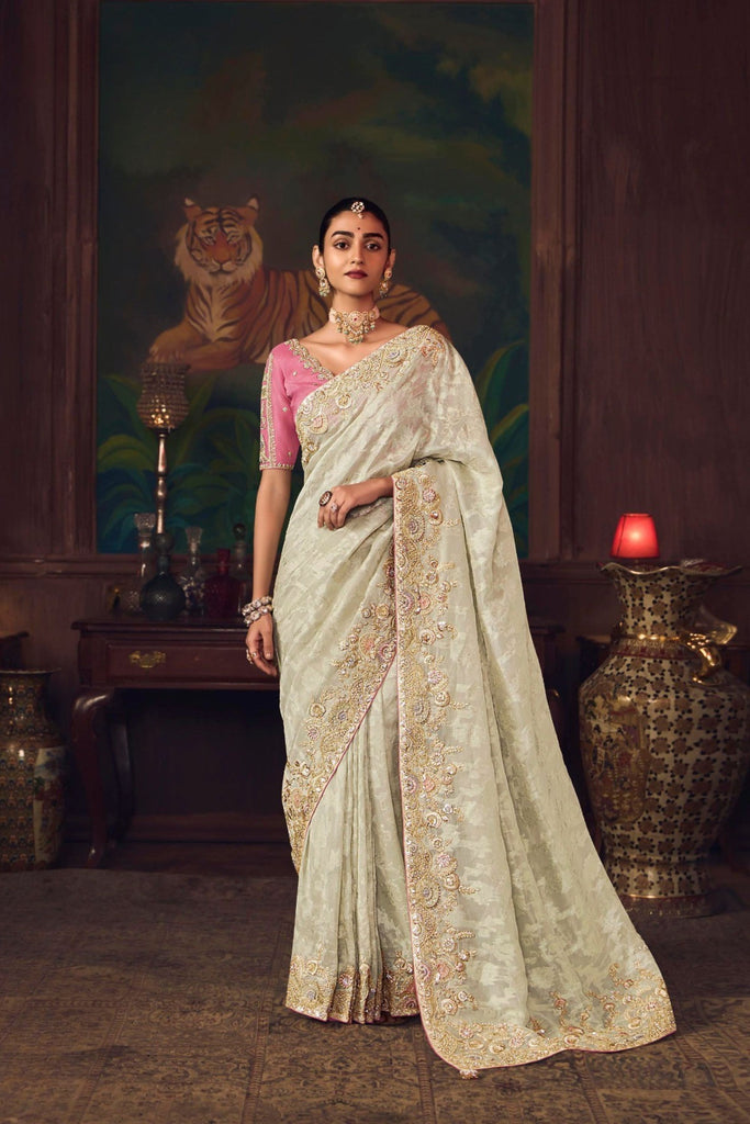 Off-White Silk Saree with Heavy Border Contrast Pink Blouse