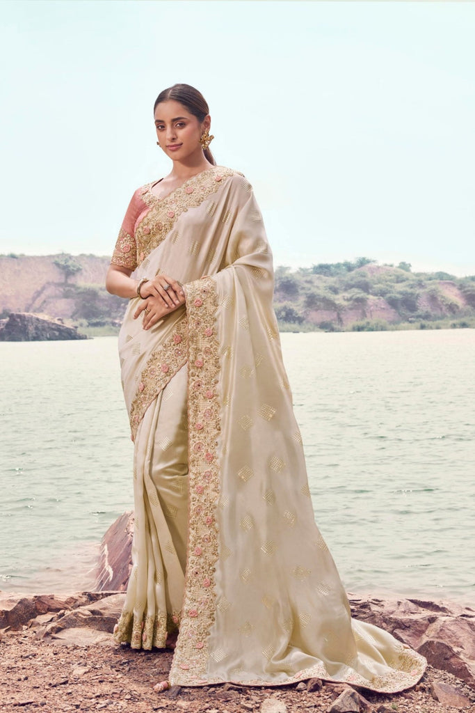 Cream Silk Saree with Heavy Embroidered Border Contrast Blouse