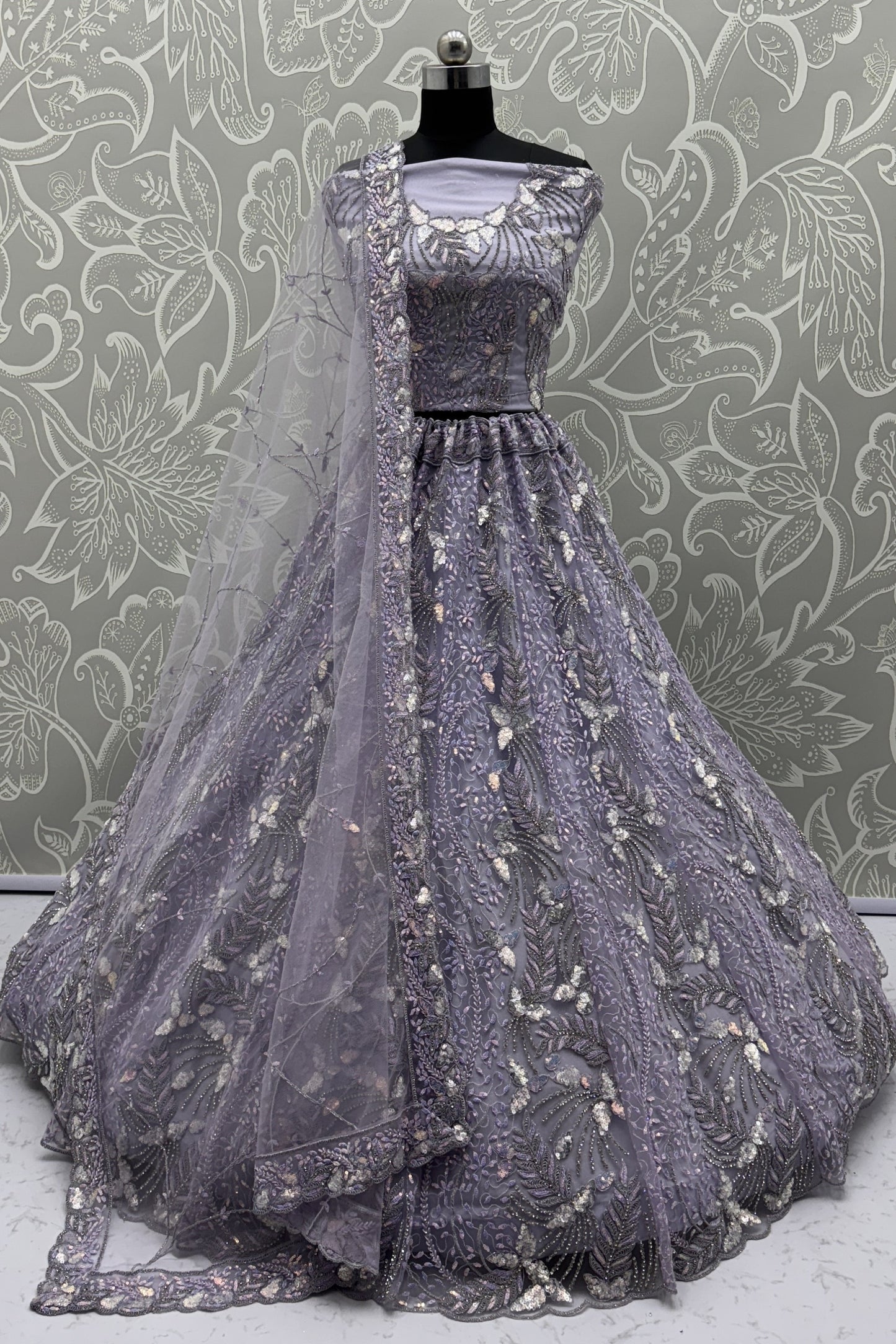 Elegant Lavender Net Bridal Lehenga Choli with Heavy Sequins and Thread Embroidery