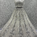 Radiant Off-White Net Bridal Lehenga Choli with Heavy Silver Sequins and Thread Embroidery