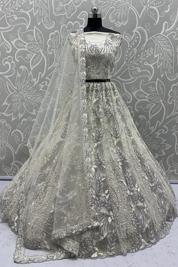 Radiant Off-White Net Bridal Lehenga Choli with Heavy Silver Sequins and Thread Embroidery