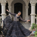 Stylish Black Bandhani Print Faux Georgette Lehenga Choli with Mirror Work