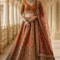 Elegant Rust Orange Gadhwal Silk Embroidered Bridal Lehenga Choli with Zari and Sequins Work Dupatta