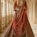 Elegant Rust Orange Gadhwal Silk Embroidered Bridal Lehenga Choli with Zari and Sequins Work Dupatta